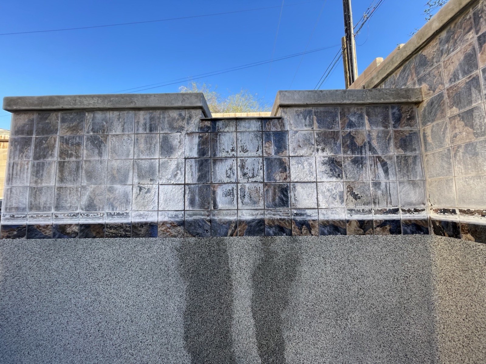 Waterline tile with calcium scale, before the work